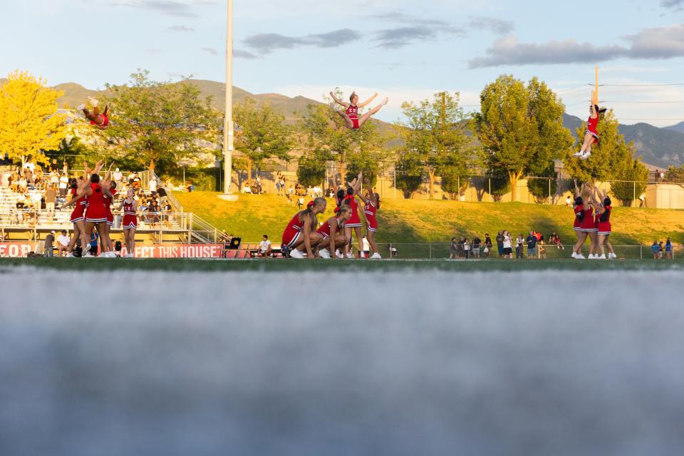 East’s cheer team performs during half time at their high school football season opener against Orem at East High School in Salt Lake City on Friday, Aug. 11, 2023. | Megan Nielsen, Deseret News