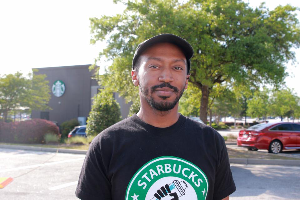 FILE - Starbucks union organizer Jaysin Saxton poses for a photo after the votes are tallied on Thursday, April 28, 2022. He recently was fired from his job in Augusta.