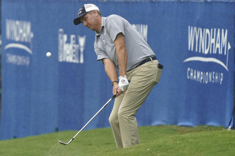 Brendon Todd chips to the 15th hole during the first round of the Wyndham Championship golf tournament in Greensboro, N.C., Thursday, Aug. 3, 2023. (AP Photo/Chuck Burton)