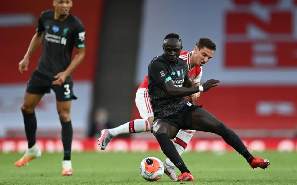 Cedric Soares battles for the ball with Sadio Mane - REUTERS