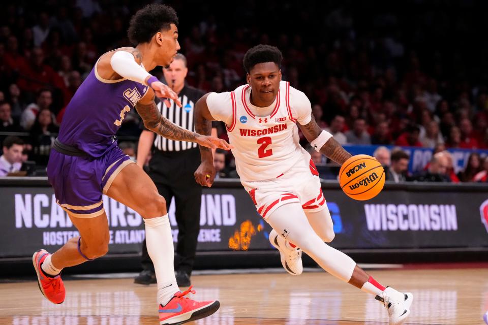 Then with Wisconsin, AJ Storr dribbles the ball against James Madison during the first round of the NCAA tournament at the Barclays Center in Brooklyn, New York, on March 22, 2024.