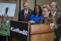 Rep. William Lacy Clay, D-Mo., left, and Judy Pace Flood, with Sen. Roy Blunt, R-Mo., right, as Rep. Ann Wagner, R-Mo., speaks during a news conference as they call for the late Curt Flood to be inducted into the Baseball Hall of Fame, on Capitol Hill, Thursday, Feb. 27, 2020 in Washington. (AP Photo/Alex Brandon)