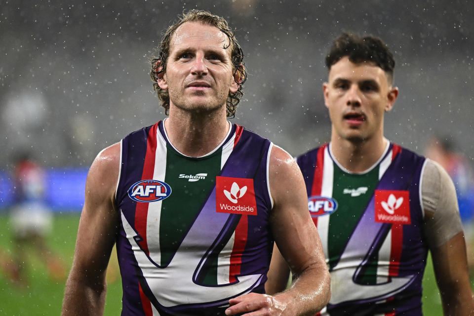 Pictured left, Fremantle's David Mundy looking to fans after his side's loss against the Melbourne Demons at Optus Stadium. 