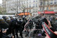 Protesters clash with riot police during a rally against global warming on November 29, 2015 in Paris