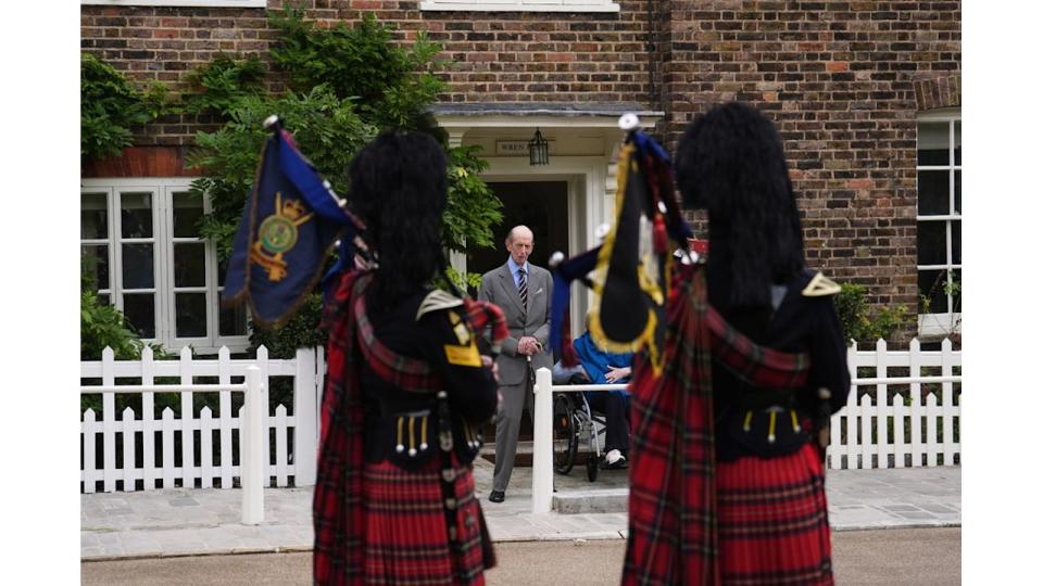 Duke of Kent watching pipers on birthday