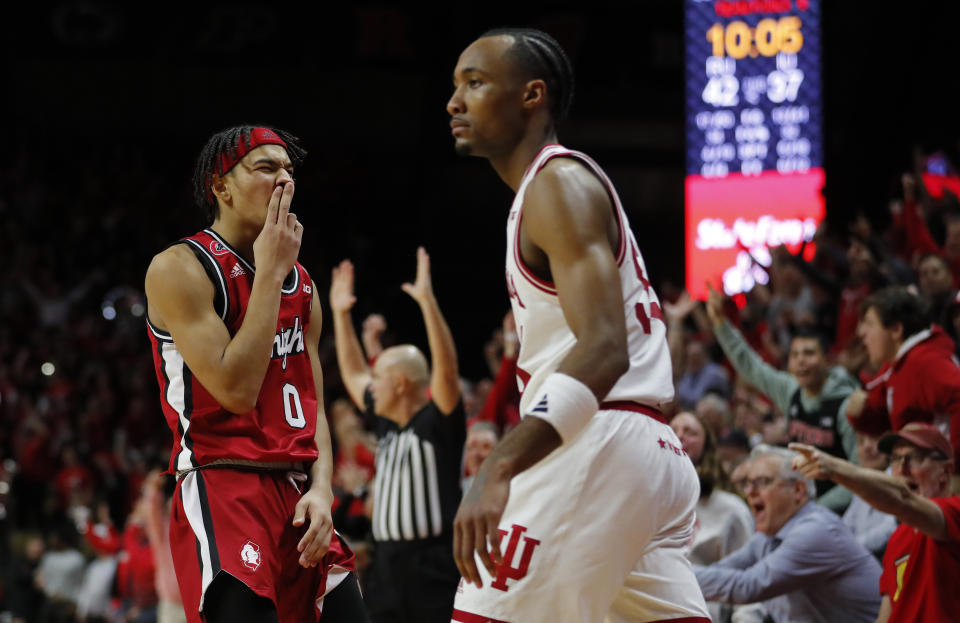 Rutgers guard Derek Simpson (0) reacts after making a 3-point basket against Indiana guard Tamar Bates, right, during the second half of an NCAA college basketball game in Piscataway, N.J., Saturday, Dec. 3, 2022. (AP Photo/Noah K. Murray)