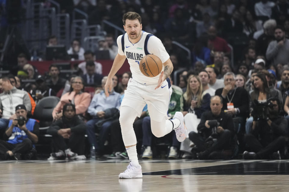 Dallas Mavericks' Luka Doncic brings the ball up during the first half of the team's NBA basketball game against the Los Angeles Clippers on Saturday, Nov. 25, 2023, in Los Angeles. (AP Photo/Jae C. Hong)