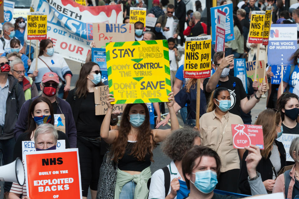 NHS staff march from BBC Broadcasting House to Trafalgar Square through central London in a protest to demand 15% pay rise for NHS workers on 12 September, 2020 in London, England. Protesters demonstrate against not being included in the government's pay deal for 900,000 public sector workers amid the sacrifices and hardship experienced during the coronavirus pandemic. (Photo by WIktor Szymanowicz/NurPhoto via Getty Images)