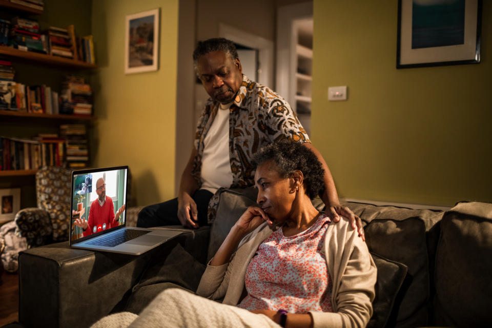 an older couple on a video call with family