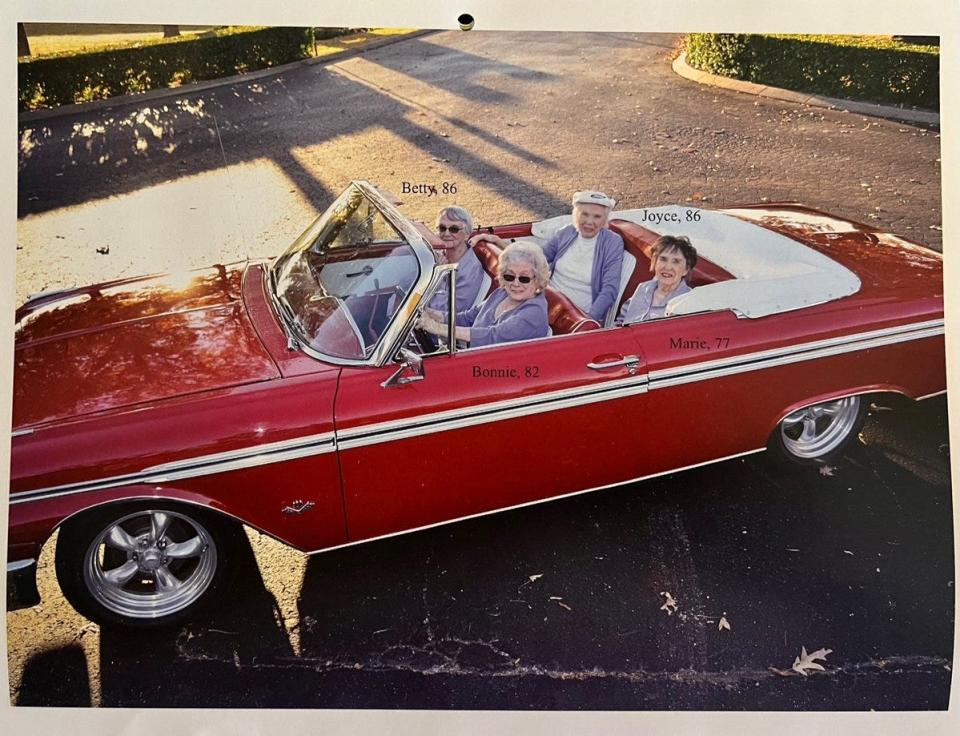 Sugar Creek Senior Living Community residents pose in a classic Ford red car for the annual themed calendar.