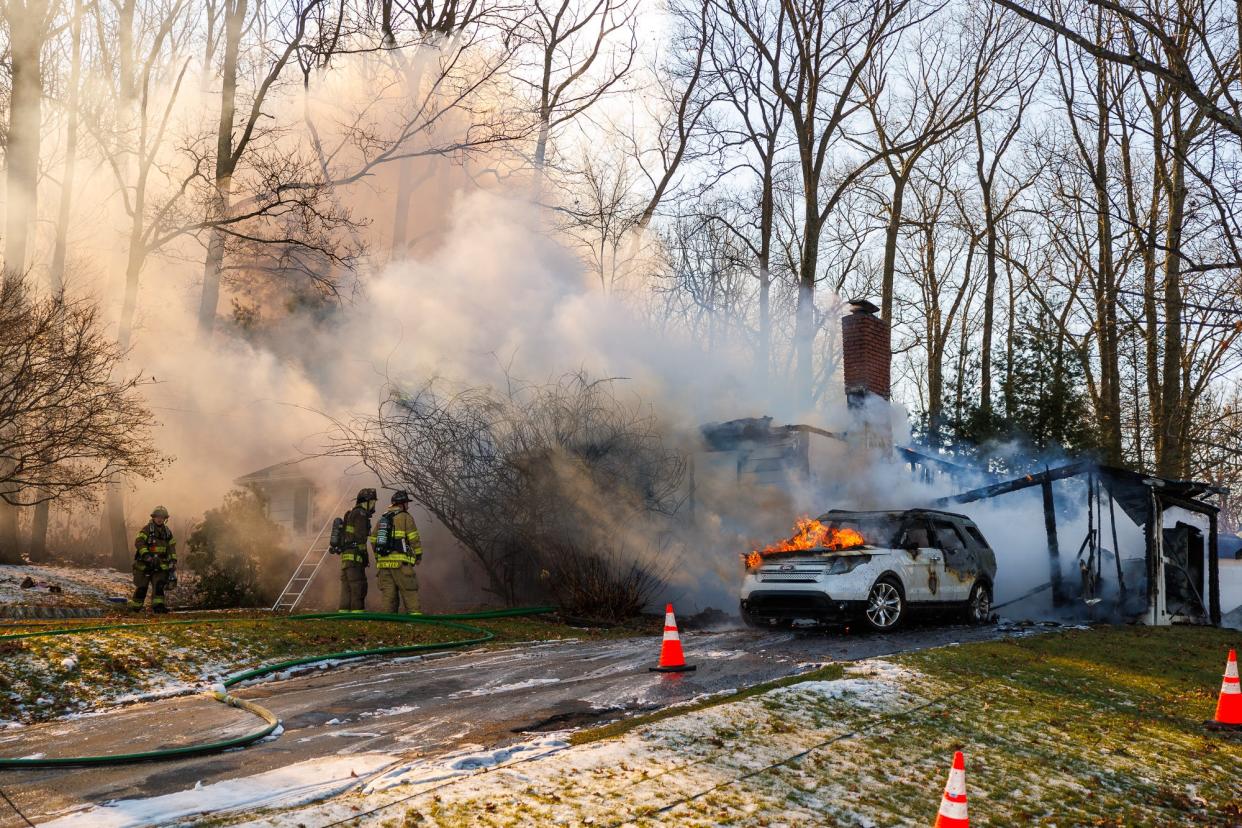 Firefighters work at the scene of a double-fatal house fire caused by a resident smoking on home oxygen in West Manheim Township, Pennsylvania. Five people were in the home when the fire broke out, with a four-year-old and a 79-year old dying, one occupant transported, and two others declining EMS.