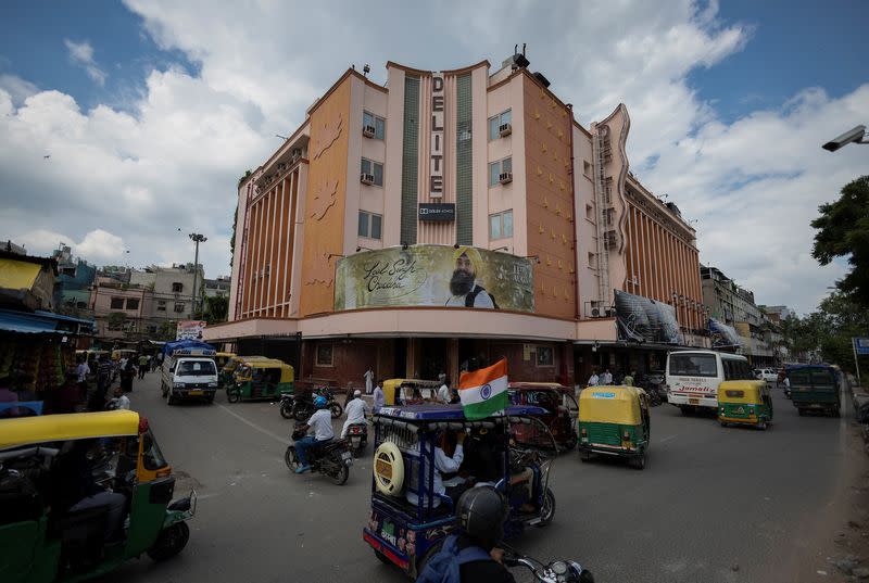 A poster of Aamir Khan-starrer "Laal Singh Chaddha", an official remake of the 1994 film "Forrest Gump" is seen outside a cinema in New Delhi