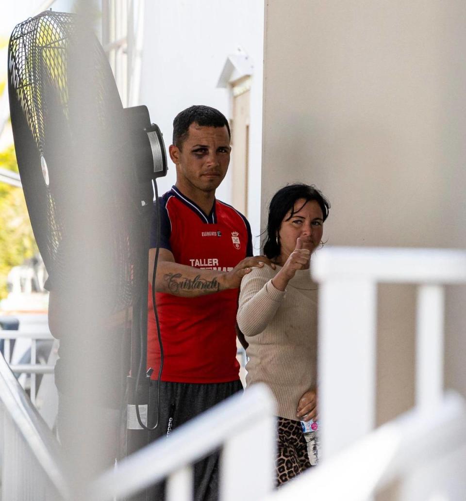 A group of Cuban migrants react as they enter the U.S. Customs and Border Protection office on Sunday, Jan. 8, 2023, in Marathon, Fla.