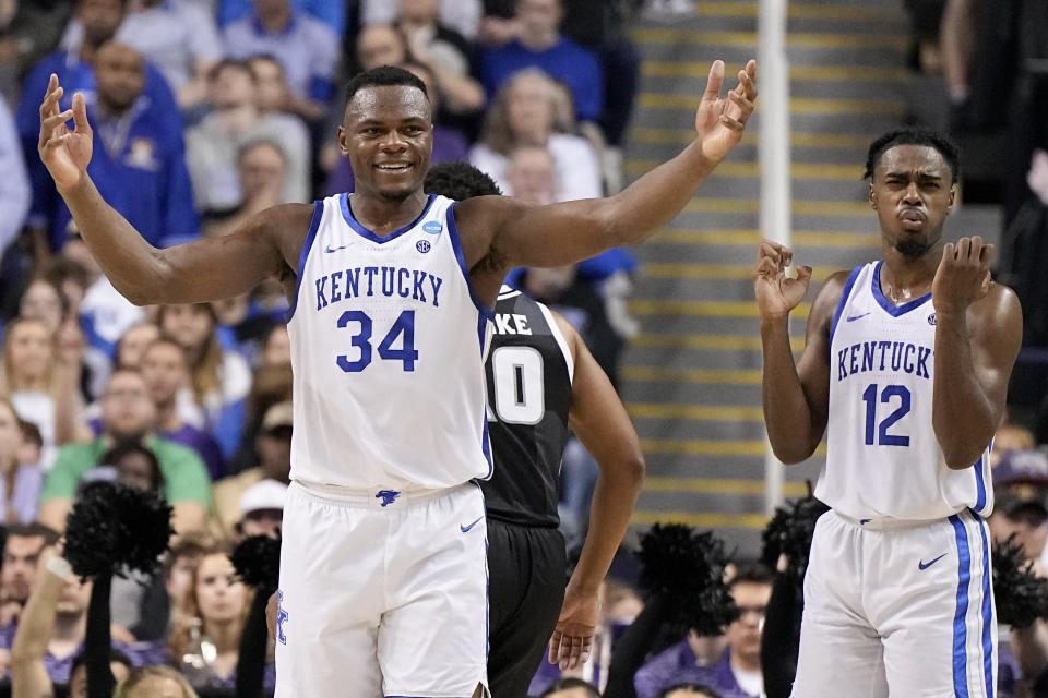 Kentucky forward Oscar Tshiebwe reacts during their win against Providence in the second half of a first-round college basketball game in the NCAA Tournament on Friday, March 17, 2023, in Greensboro, N.C. (AP Photo/Chris Carlson)