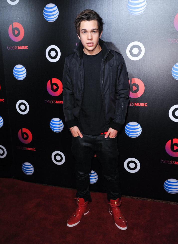 Austin Mahone arrives at Beats Music Launch Party at the Belasco Theatre, Friday, Jan. 24, 2014, in Los Angeles, Calif. (Photo by Richard Shotwell Invision/AP)
