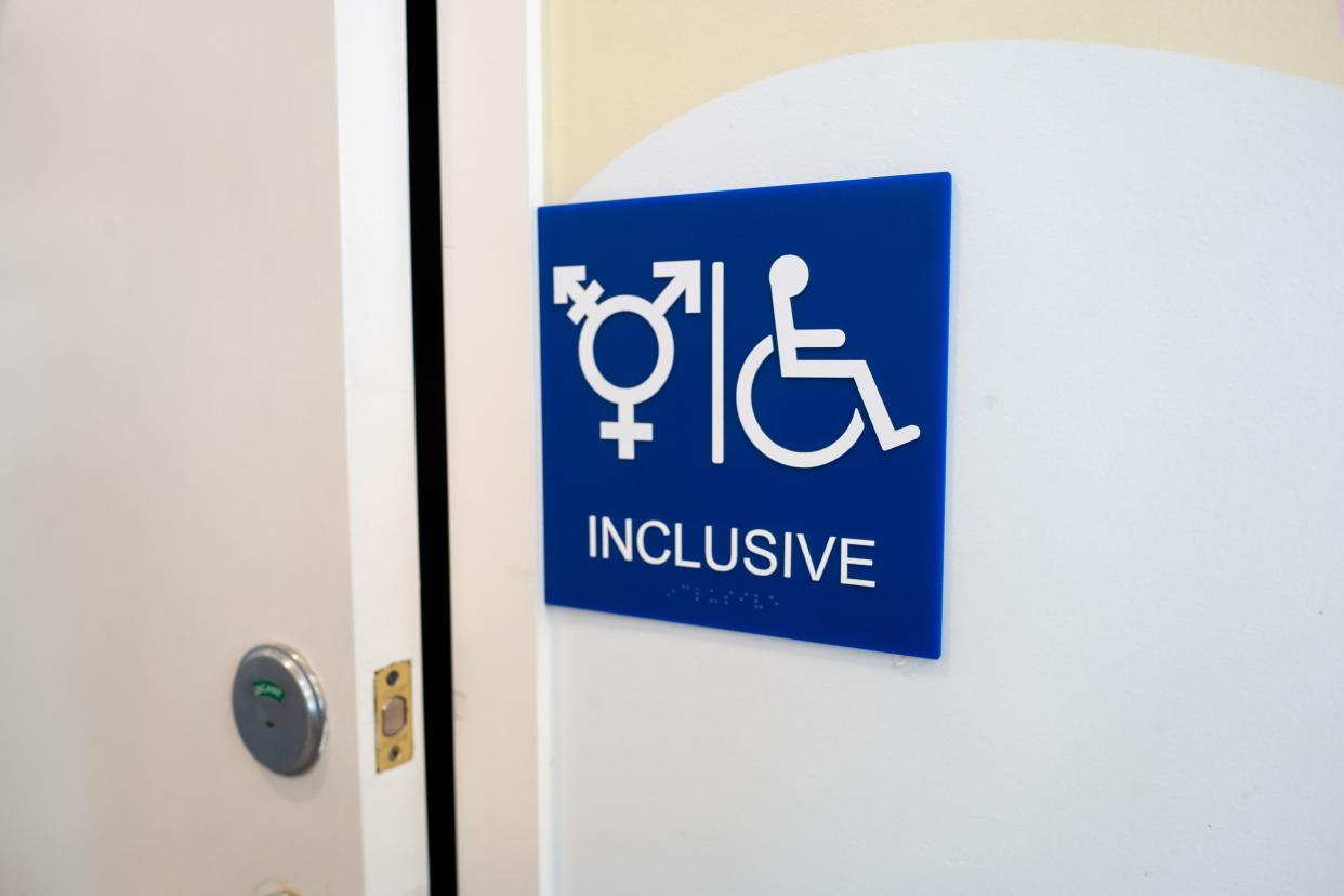 Sign for inclusive restroom, with symbol indicating male, female and transgender as well as handicapped symbol, part of LGBT rights initiatives in the Mission District neighborhood of San Francisco, California, July 18, 2019. (Photo by Smith Collection/Gado/Getty Images)