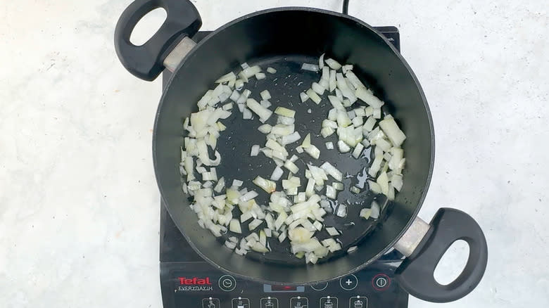 onion frying in pan