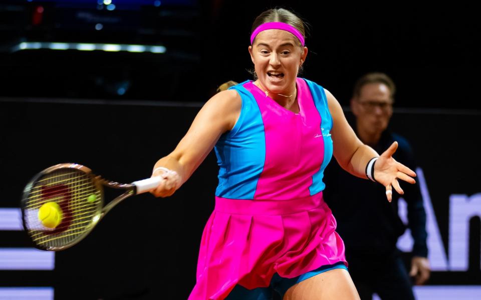 Jelena Ostapenko of Latvia in action against Emma Raducanu of Great Britain in the first round of the Porsche Tennis Grand Prix Stuttgart 2023 at Porsche Arena - Getty Images/Robert Prange