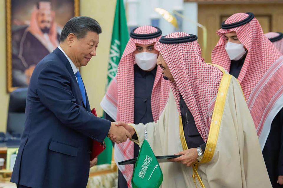 In this photo made available by Saudi Press Agency, SPA, Chinese President Xi Jinping, left, shakes hands with Saudi King Salman, in Riyadh, Saudi Arabia, Thursday, Dec. 8, 2022. (Saudi Press Agency via AP)