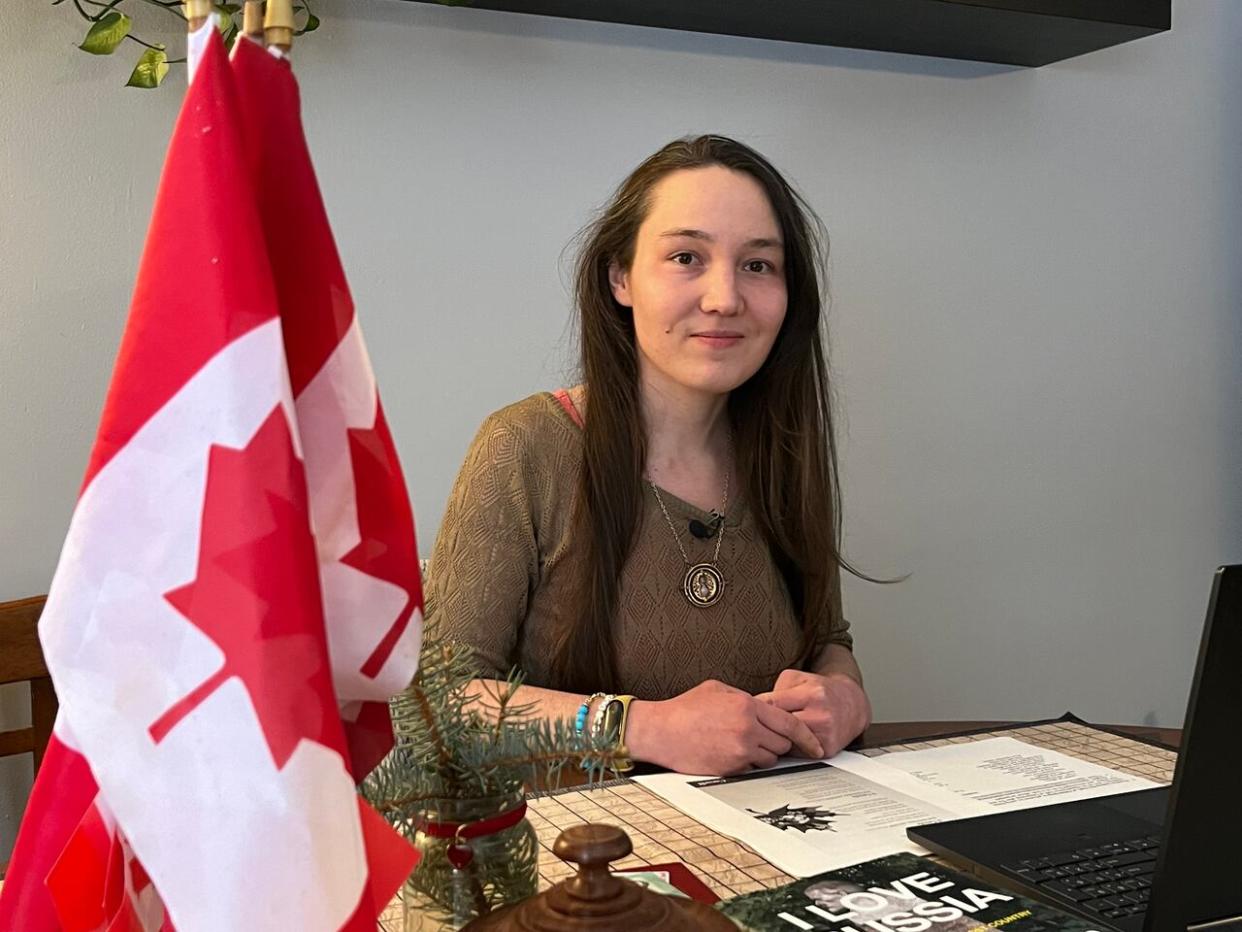 Maria Kartasheva waits for her citizenship ceremony to begin at her home in Ottawa on Tuesday, Jan. 9, 2024. (Matthew Kupfer/CBC - image credit)