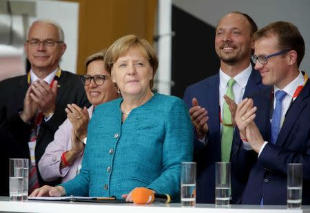 German Chancellor Angela Merkel, a top candidate of the Christian Democratic Union Party (CDU), attends an election rally ahead of the upcoming federal election in Annaberg-Buchholz, Germany August 17, 2017. REUTERS/Matthias Schumann