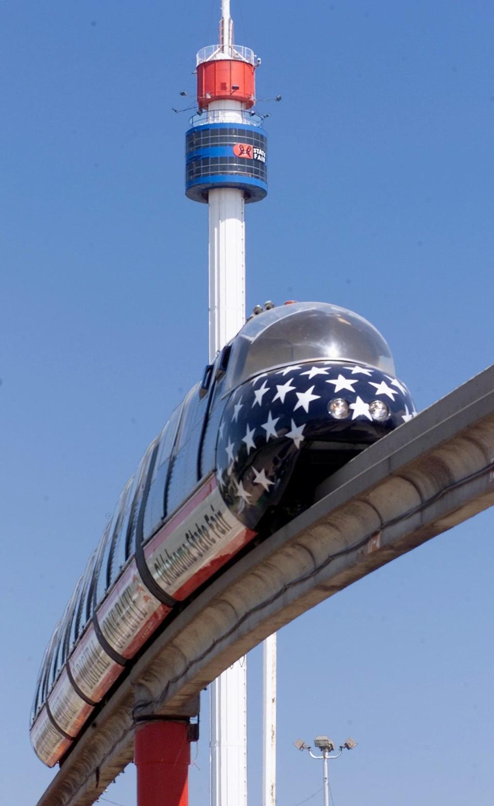 RIDES: AT&T Wireless Monorail and Conoco Space Needle pictured at Oklahoma State Fair 2001.  Staff Photo by Roger Klock