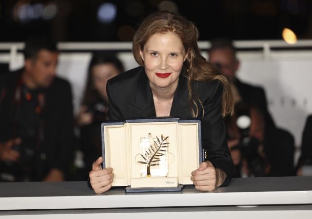 Justine Triet, winner of the Palme d'Or for 'Anatomy of a Fall,' poses for photographers during a photo call following the awards ceremony at the 76th international film festival, Cannes, southern France, Saturday, May 27, 2023. (Photo by Vianney Le Caer/Invision/AP)