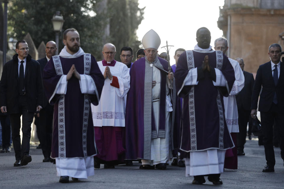 Pope Francis, center, walks in procession to the Basilica of Santa Sabina before the Ash Wednesday Mass opening Lent, the forty-day period of abstinence and deprivation for Christians before Holy Week and Easter, in Rome, Wednesday, Feb. 26, 2020. Pope Francis is marking Ash Wednesday with prayer and a solemn procession between two churches on one of ancient Rome's seven hills. (AP Photo/Gregorio Borgia)