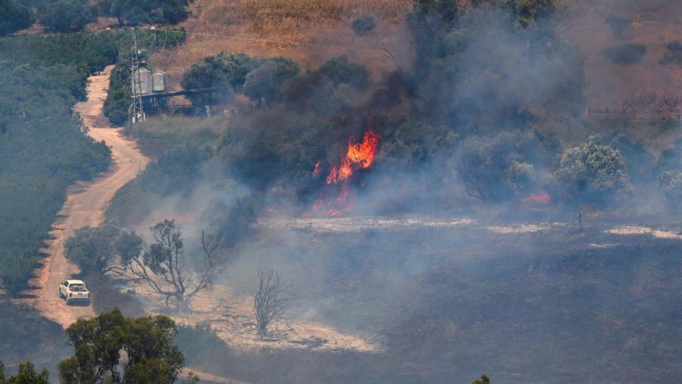 PHOTO: A fire blazes on the Israeli side of the Israel-Lebanon border following attacks from Lebanon, amid cross-border hostilities between Hezbollah and Israeli forces, in northern Israel June 18, 2024.  (Ayal Margolin/Reuters)