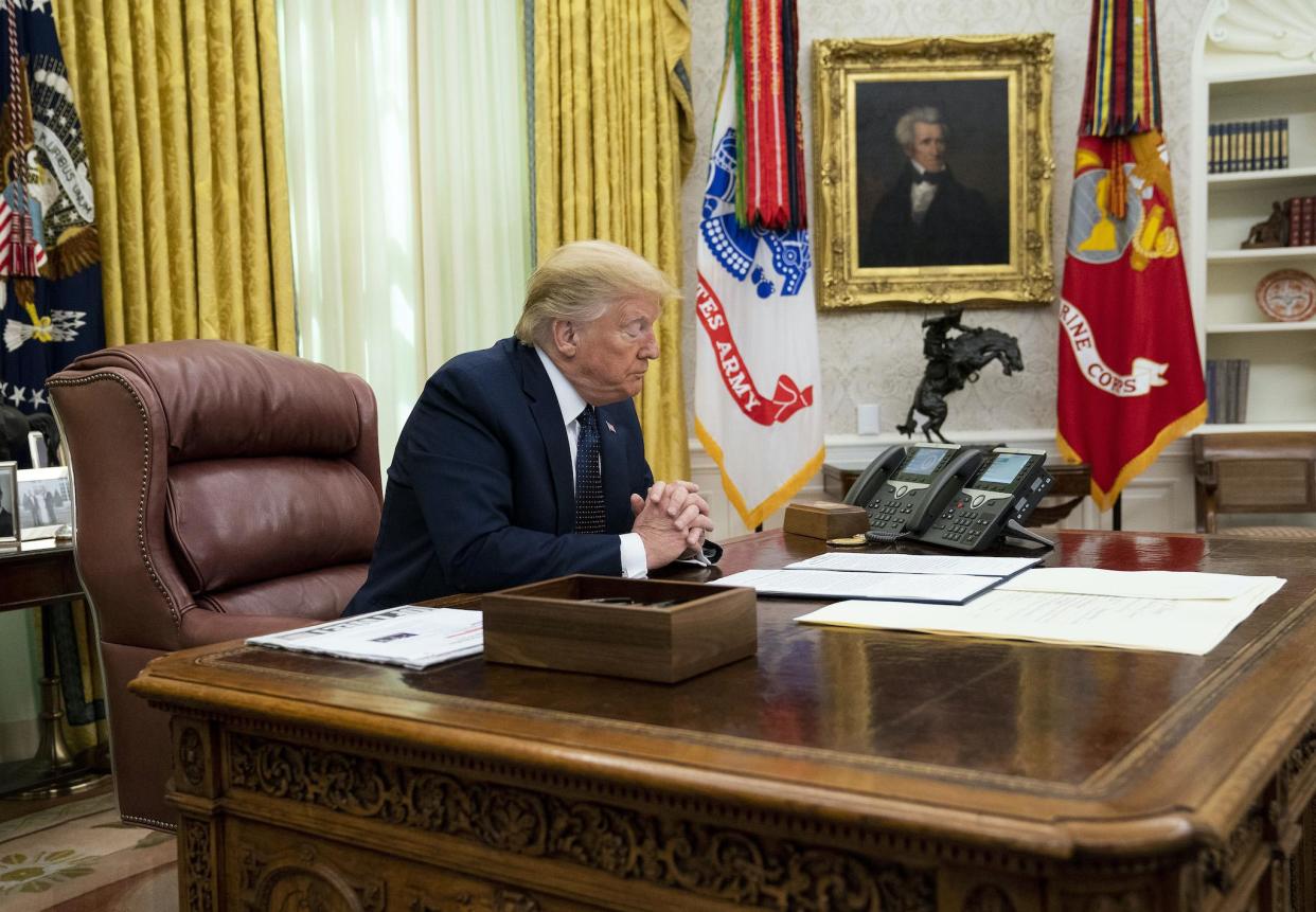 President Donald Trump with Attorney General William Barr, make remarks before signing an executive order in the Oval Office that will punish Facebook, Google and Twitter for the way they police content online: Doug Mills/The New York Times