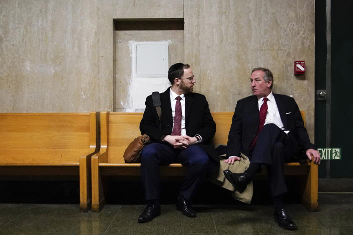 Defense attorneys Michael van der Veen, right, and Gedalia M. Stern, left, talk outside the courtroom during jury deliberation in the Trump Organization tax fraud case, Tuesday, Dec. 6, 2022, in New York. (AP Photo/Julia Nikhinson)