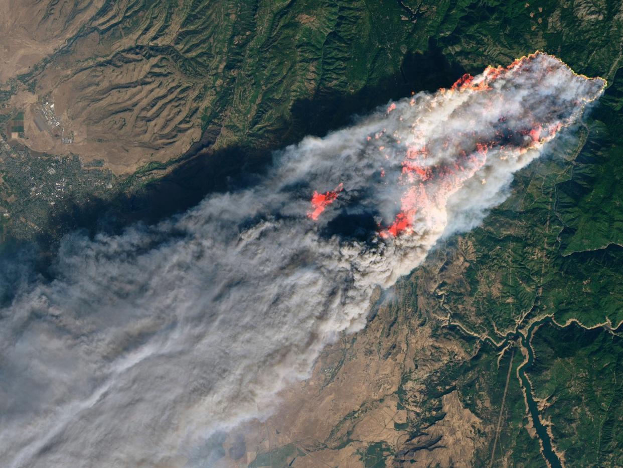 Enhanced satellite image provided by Nasa's Earth Observatory shows the Camp Fire in Paradise, California, on Thursday, 8 November: Nasa via AP
