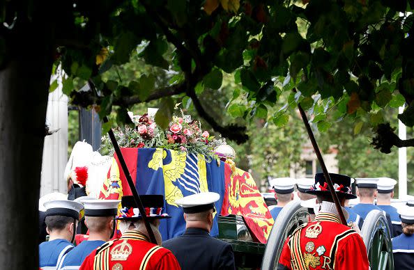 LONDON, ENGLAND - SEPTEMBER 19: The coffin of Queen Elizabeth II with the Imperial State Crown resting on top i proceeds towards Westminster Abbey on September 19, 2022 in London, England. Elizabeth Alexandra Mary Windsor was born in Bruton Street, Mayfair, London on 21 April 1926. She married Prince Philip in 1947 and ascended the throne of the United Kingdom and Commonwealth on 6 February 1952 after the death of her Father, King George VI. Queen Elizabeth II died at Balmoral Castle in Scotland on September 8, 2022, and is succeeded by her eldest son, King Charles III.  (Photo by Tristan Fewings/Getty Images)