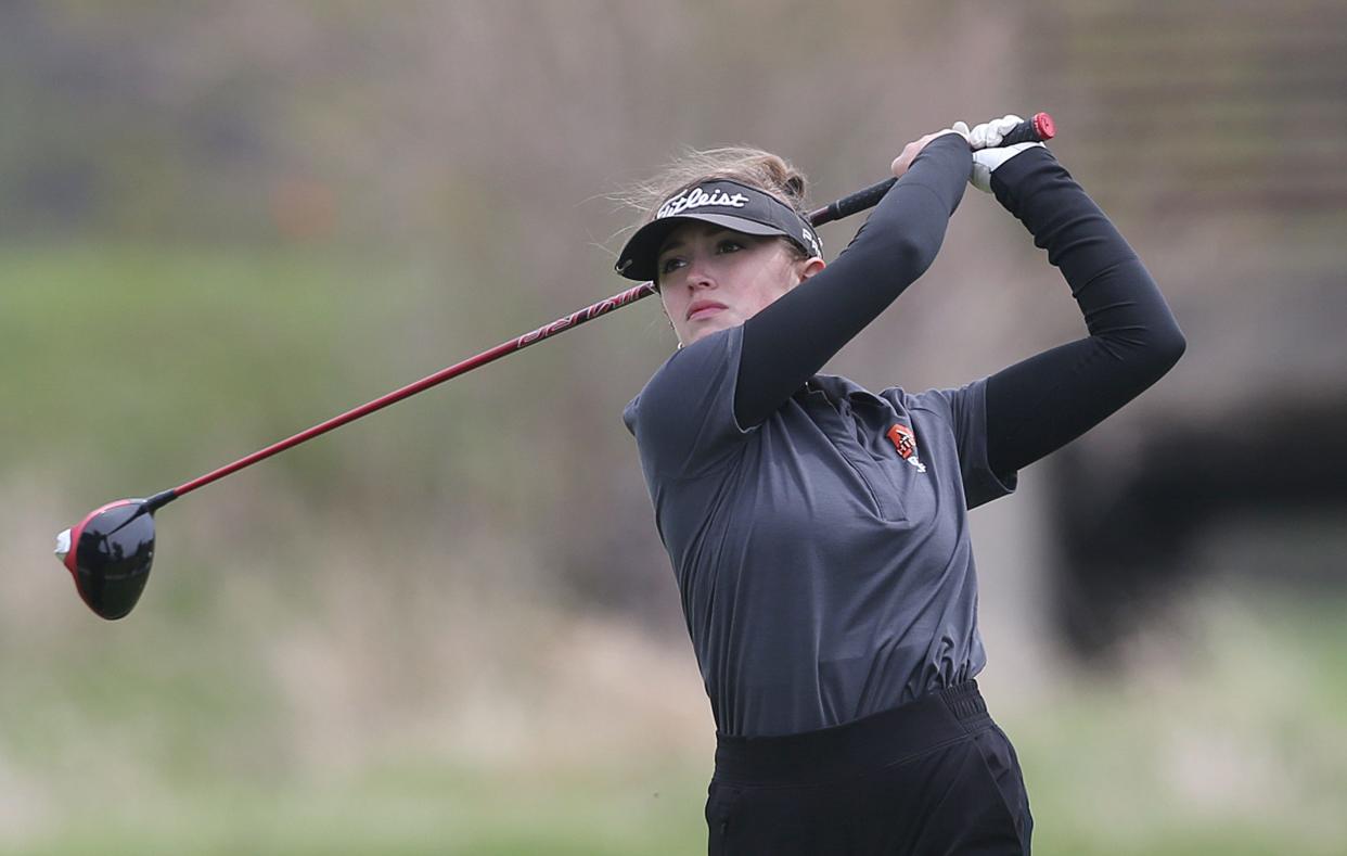 Ames' Elizabeth Duncan looks at the ball after a tee onto the 9th hole in the Turk Bowman Invitational Girls Golf meet at Veenker Memorial Golf Course on Monday in Ames.