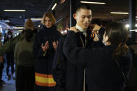 Models get ready in the backstage prior to the start of the K-Way men's Fall-Winter 2022-23 fashion show, unveiled during the Fashion Week in Milan, Italy, Monday, Jan. 17, 2022. (AP Photo/Antonio Calanni)