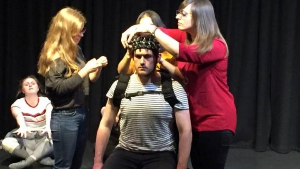 An actor is fitted with brain imaging headband and other monitors