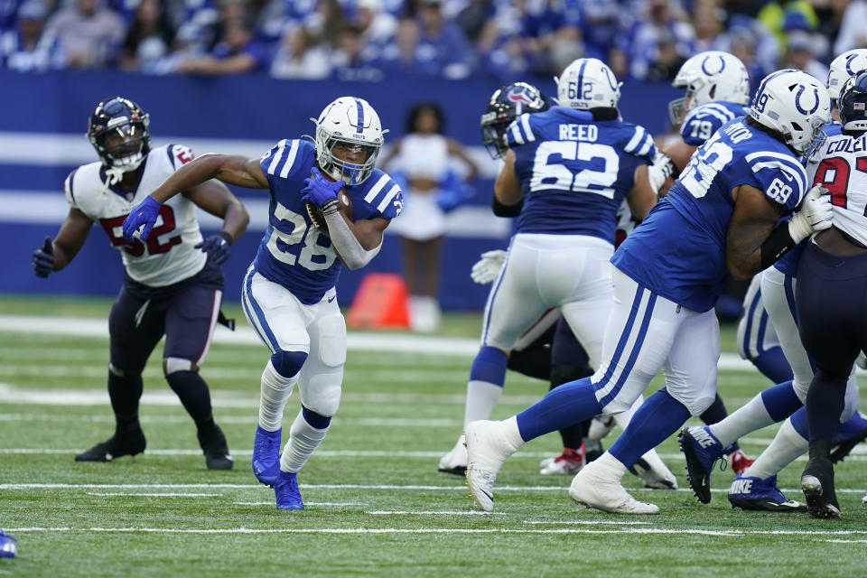 Indianapolis Colts' Jonathan Taylor (28) runs with the ball during the second half of an NFL football game against the Houston Texans, Sunday, Oct. 17, 2021, in Indianapolis. (AP Photo/Michael Conroy)