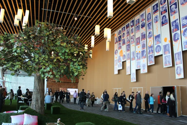 TED attendees pass a nature-themed socializing spot outside the conference theater, at the Vancouver convention cente, on February 16, 2016