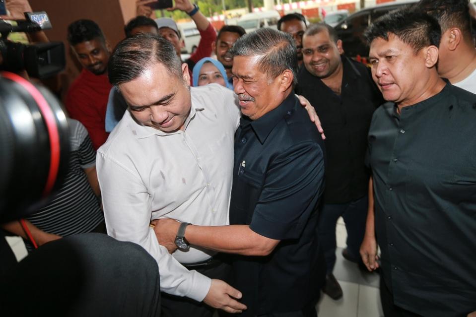 DAP’s Anthony Loke (left) and Amanah president Mohamad Sabu greet each other as they arrive for the Pakatan Harapan Presidential Council Meeting at PKR’s headquarters in Kuala Lumpur February 25,2020. — Picture by Ahmad Zamzahuri