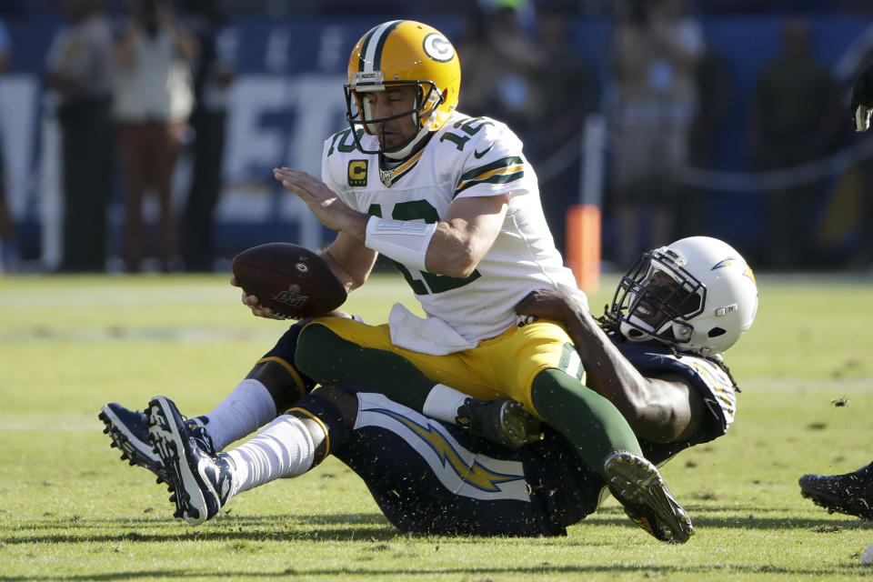 Green Bay Packers quarterback Aaron Rodgers is sacked by Los Angeles Chargers defensive end Melvin Ingram during the first half of an NFL football game Sunday, Nov. 3, 2019, in Carson, Calif. (AP Photo/Marcio Jose Sanchez)