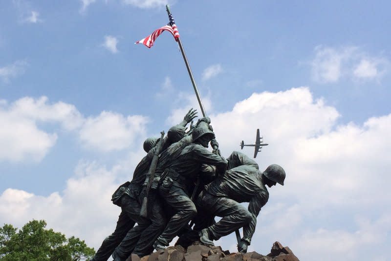 A World War II-era B-29 Superfortress flies over the Iwo Jima Memorial in Washington, D.C., on May 8, 2015. On February 23, 1945, members of the 5th Division of the U.S. Marines planted a U.S. flag atop Mount Suribachi on the Pacific island of Iwo Jima. File Photo by Ioana Dietsch/UPI