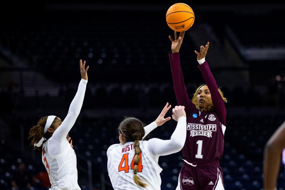 Mississippi State's Ahlana Smith (1) shoots over Illinois' Kendall Bostic (44) and Makira Cook (3) during the first half of a First Four game in the NCAA women's college basketball tournament Wednesday, March 15, 2023, in South Bend, Ind. (AP Photo/Michael Caterina)