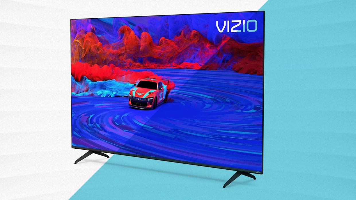 vizio flatscreen tv on legs against blue and white background