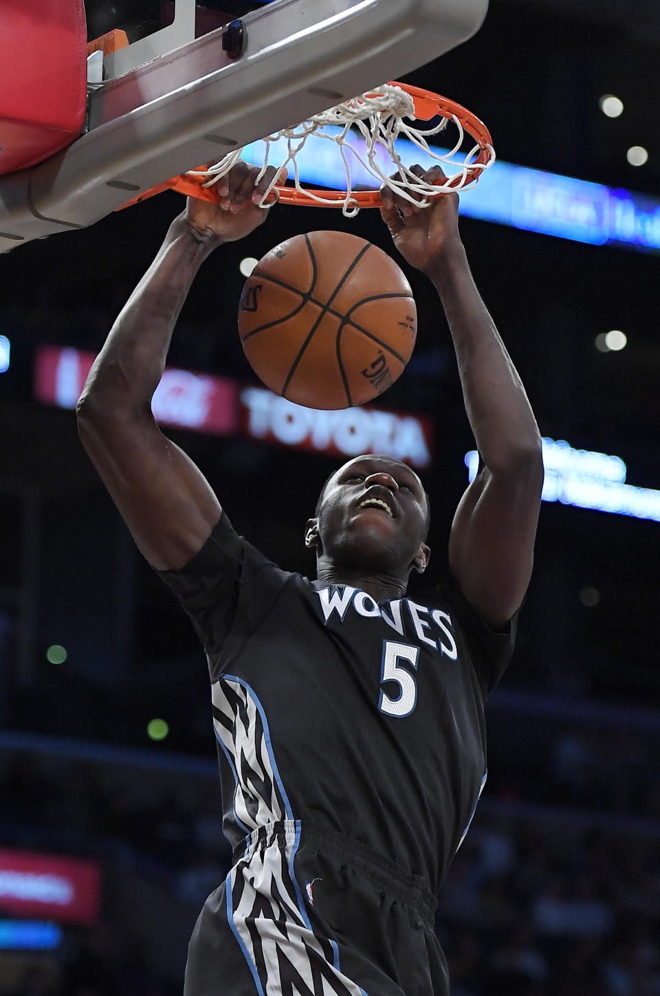Minnesota Timberwolves forward Gorgui Dieng, of Senegal, dunks during the first half of an NBA basketball game against the Los Angeles Lakers, Sunday, April 9, 2017, in Los Angeles. (AP Photo/Mark J. Terrill)