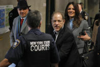 Harvey Weinstein leaves court in his rape trial, in New York, Wednesday, Jan. 22, 2020. Two of his attorneys, Arthur Aidala, and Donna Rotunno, are background left and background right. (AP Photo/Richard Drew)