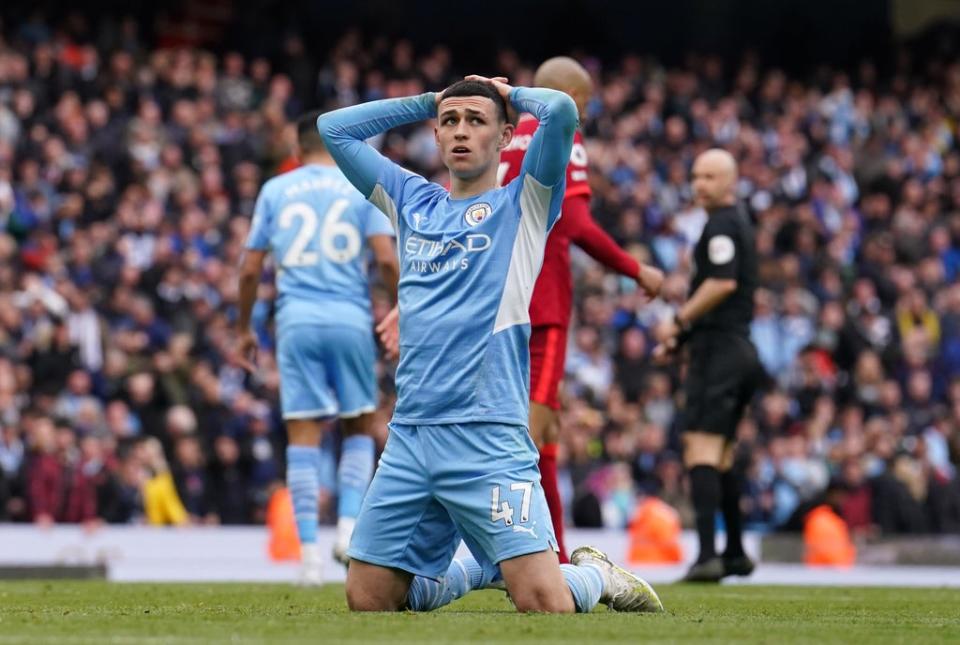 Manchester City’s Phil Foden shows his frustration after Riyad Mahrez missed a late chance against Liverpool (Martin Rickett/PA) (PA Wire)