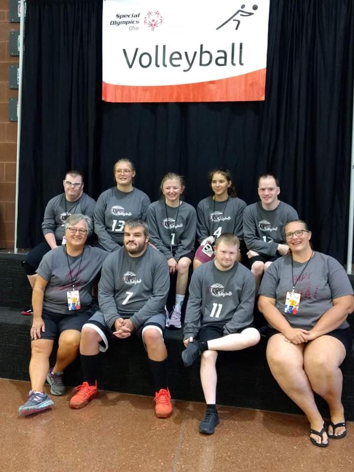 Members of the Rockets volleyball team pose between games.