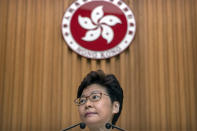 Hong Kong Chief Executive Carrie Lam listens to a journalist's question during a press conference at the government building in Hong Kong, Tuesday, Oct. 15, 2019. A homemade, remote-controlled bomb intended to "kill or to harm" riot control officers was detonated as they deployed against renewed violence in Hong Kong over the weekend, police said Monday, in a further escalation of destructive street battles gripping the business hub. (AP Photo/Mark Schiefelbein)