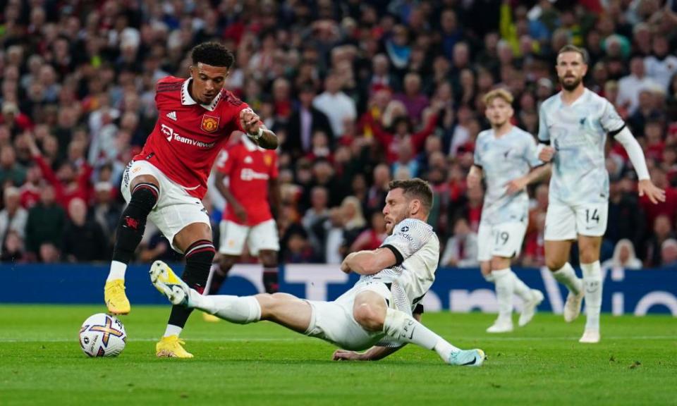 Jadon Sancho evades James Milner’s challenge before firing home for Manchester United.