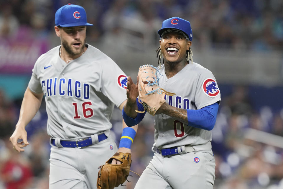 Chicago Cubs starting pitcher Marcus Stroman (0) and third baseman Patrick Wisdom (16) react to a play during the sixth inning of a baseball game against the Miami Marlins, Friday, April 28, 2023, in Miami. (AP Photo/Marta Lavandier)